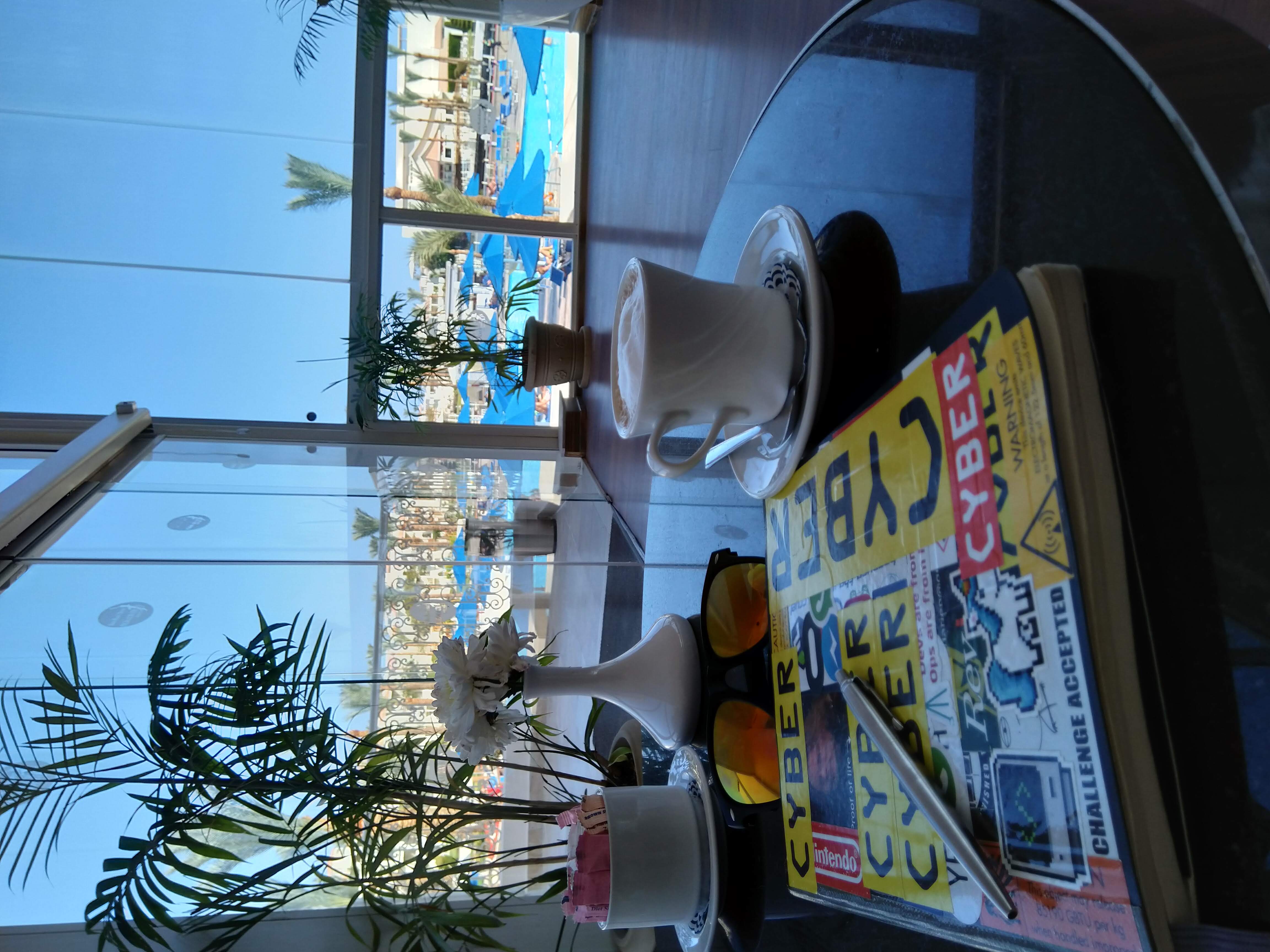 Journal laying on table with sun in background